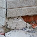 image of a home foundation wall with broken brickworks