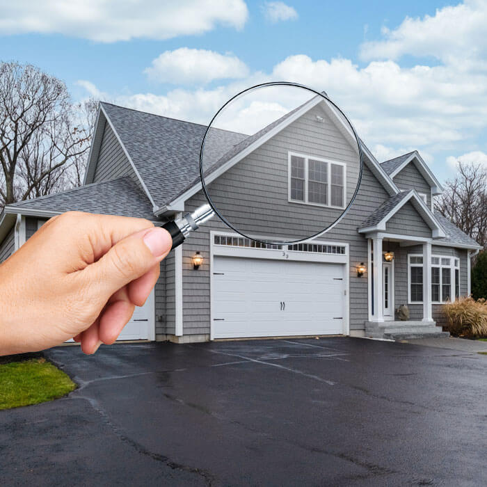 image of a magnifier and a house
